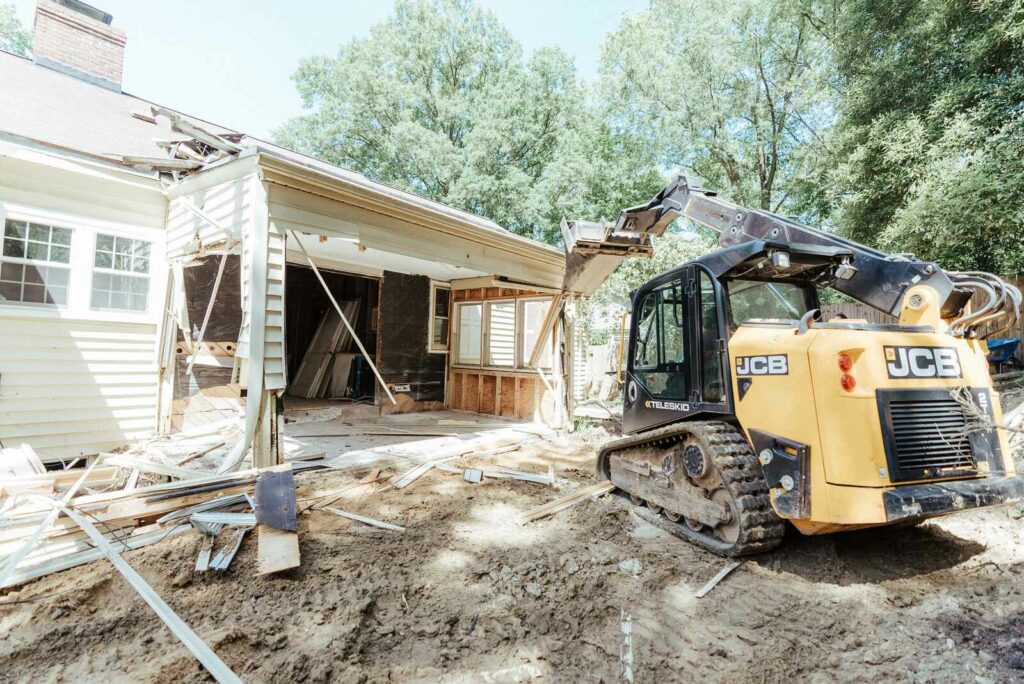 skid steer working on construction on house