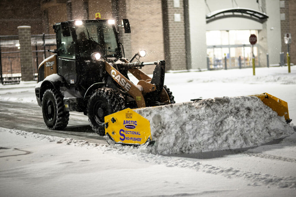 arctic snow and ice LD-pusher-on-compact-loader