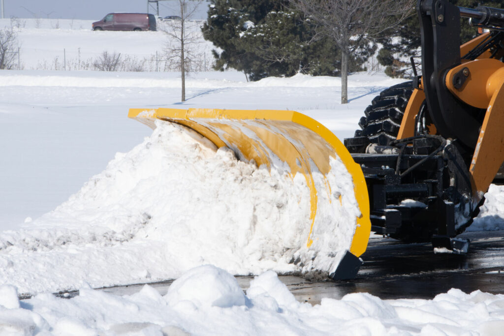 arctic snow and ice sectional snow plow plowing snow side copy