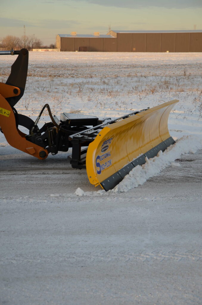 arctic snow and ice sectional snow plow plowing snow side5