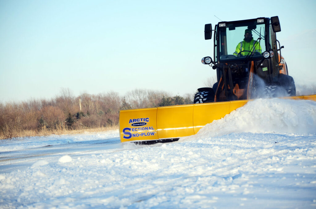 arctic snow and ice sectional snow plow plowing snow4