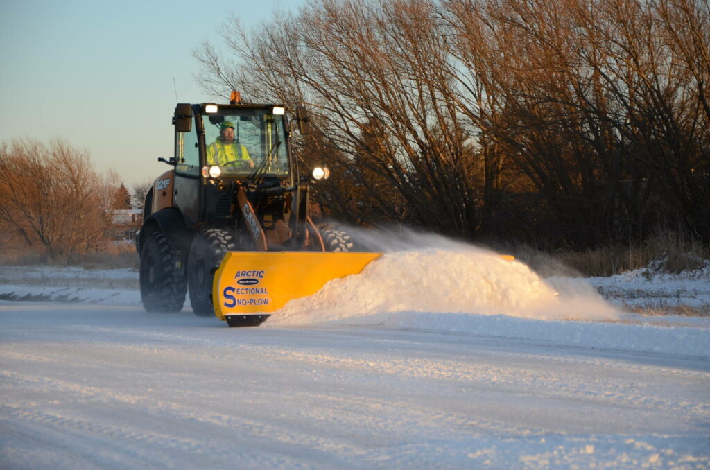 arctic snow and ice sectional snow plow plowing snow7