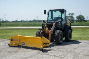 sectional sno-wing arctic snow and ice on wheel loader side