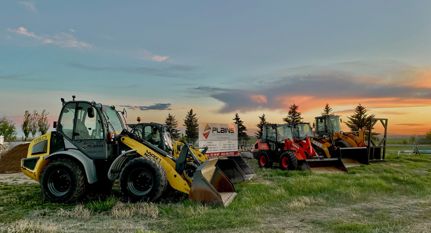 heavy-equipment-lined-up-in-field