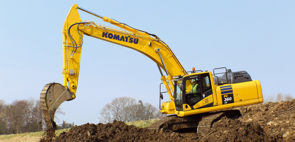 Komatsu PC360LC excavator digging at a construction site offered for rent in Western Canada for large scale projects