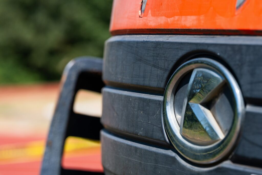 Close-up of Kubota heavy equipment logo on machinery, rented by Plains Equipment Rentals, serving Western Canada for reliable construction and industrial equipment solutions