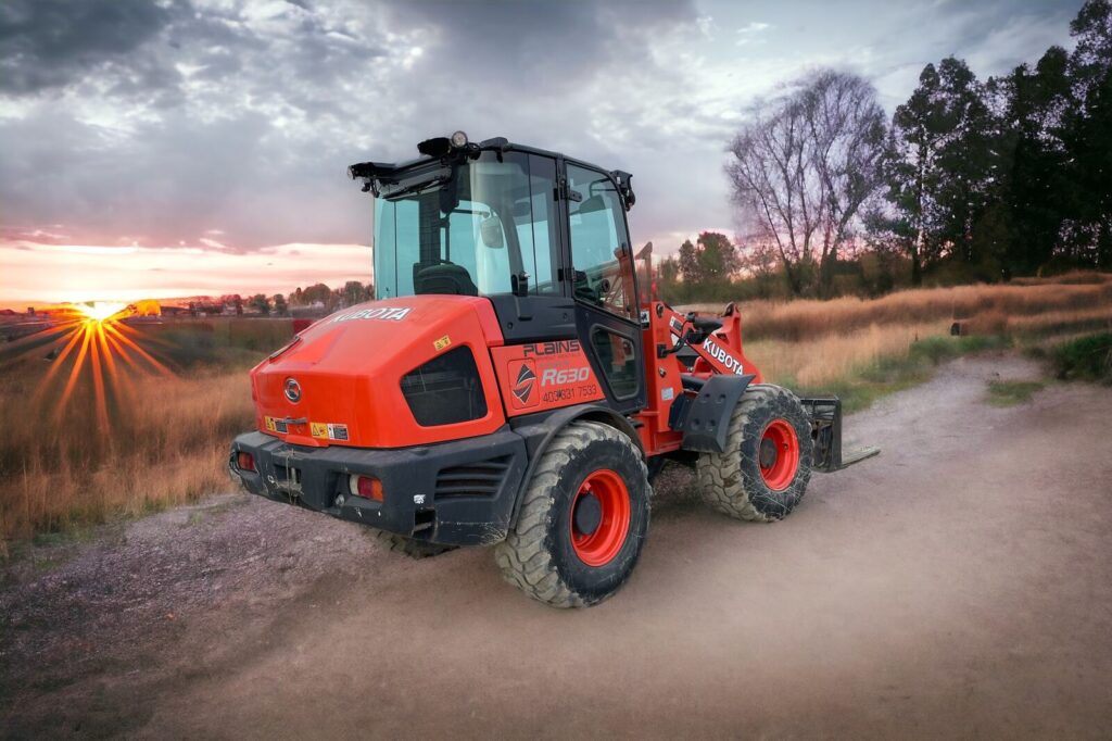 Plains Equipment Rentals Kubota R630 Loader at Sunset - Heavy Equipment Rentals in Western Canada