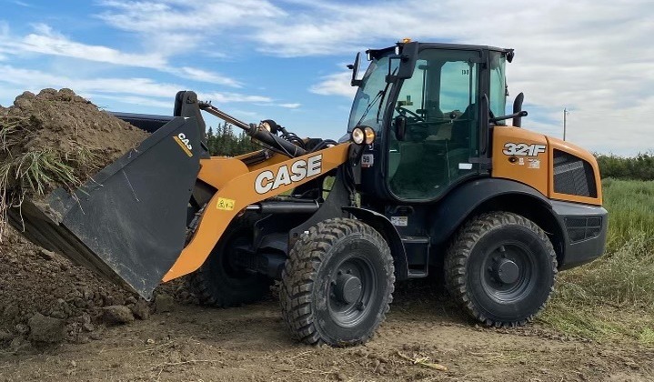 CASE-321F-wheel-loader-moving-dirt-in-a-construction-site-for-heavy-equipment-rental-in-Western-Canada