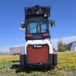 rear-view-2022-bobcat-l28-loader-with-cab-and-lift-arms-raised-for-sale-western-canada