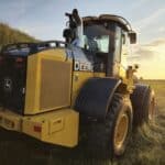 Rear angled view of John Deere 524K-II loader at sunset, Plains Equipment Rentals, Western Canada