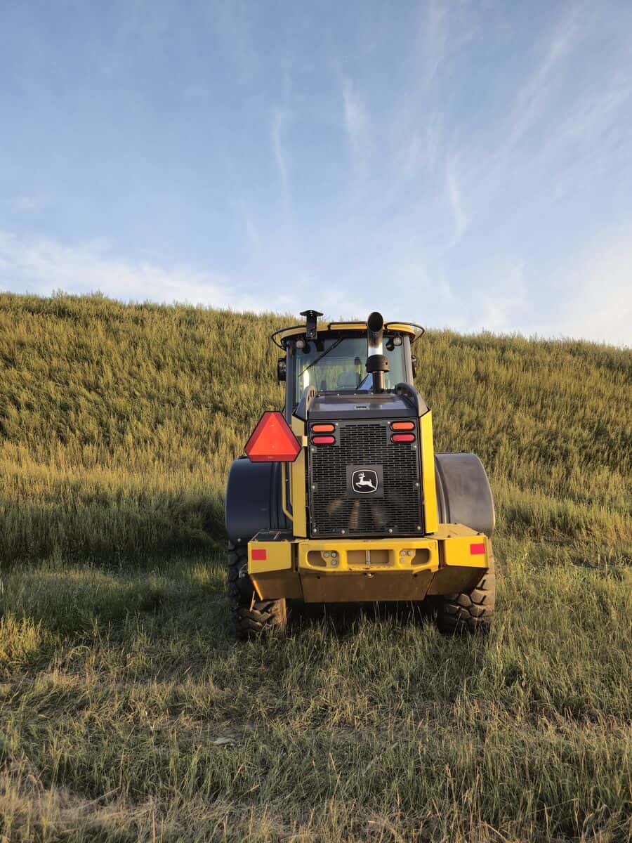 Rear view of John Deere 524K-II loader for sale from Plains Equipment Rentals in Canada