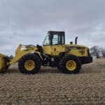 2010 Komatsu WA250-6 with front bucket at low angle showing bucket capacity