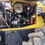 Right side engine compartment of 2010 Komatsu WA250-6 showing components