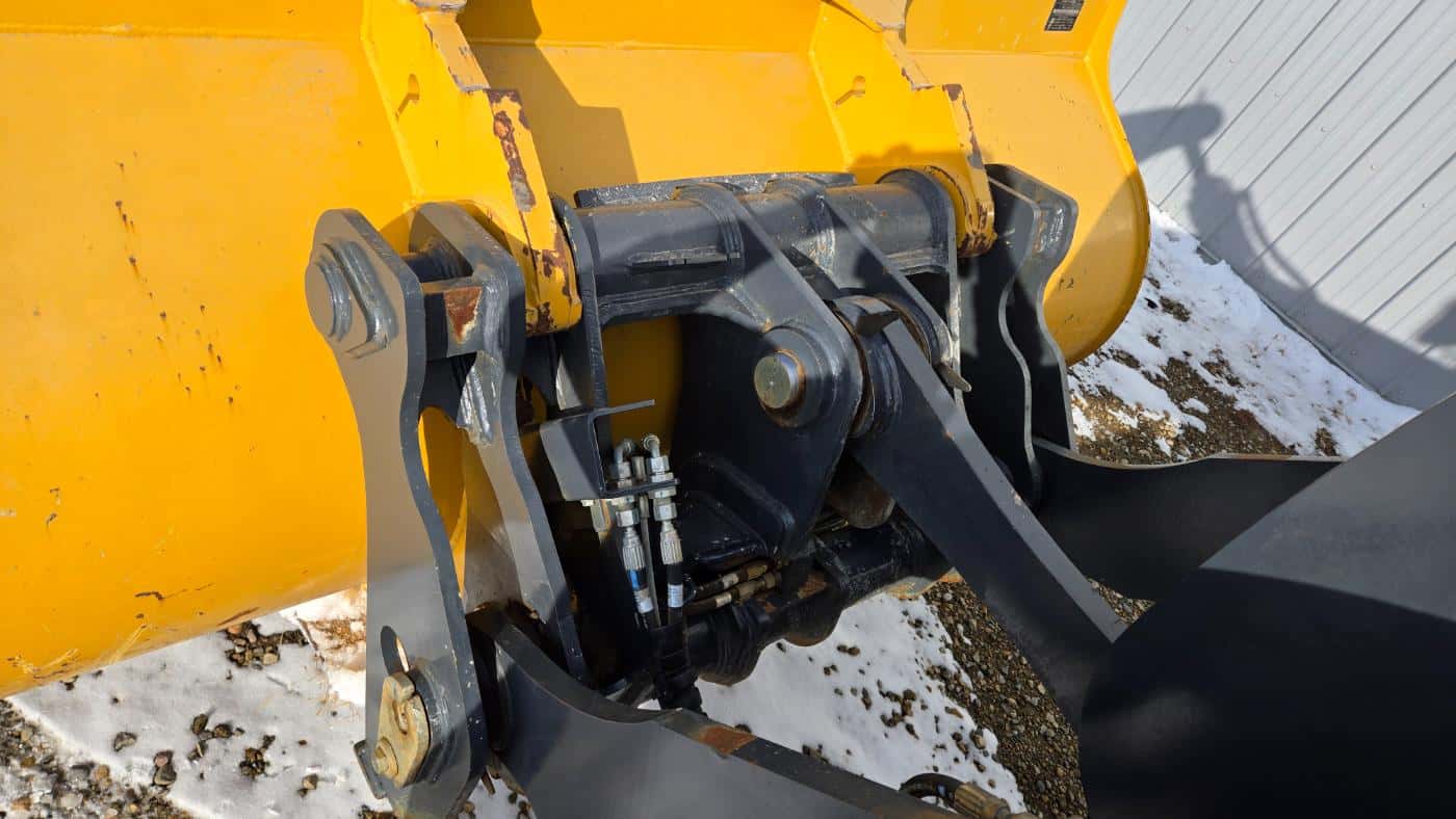 John Deere 444 P-tier snow plow bucket attachment for winter equipment rental services