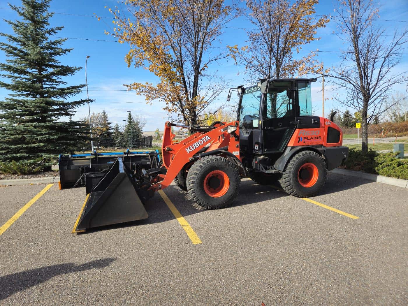 Kubota R640 wheel loader with front bucket attachment, a real Plains rental unit in Western Canada