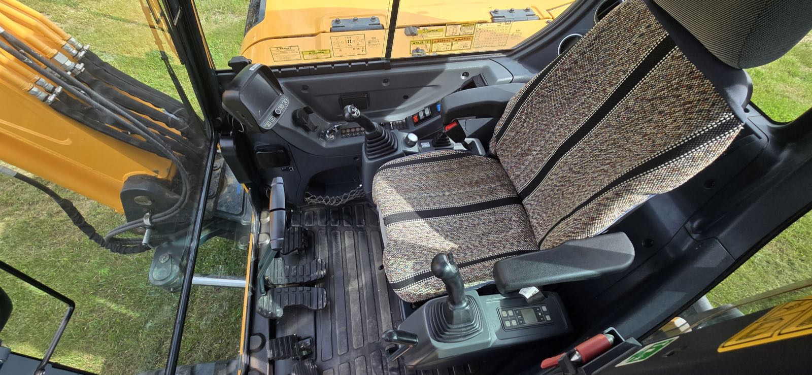 Hyundai 80CR-9A excavator cab interior with joystick controls and climate control